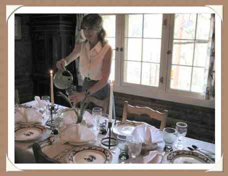 Alice McSweeney setting Dinner Table